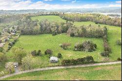 Over 36 acres of partially cleared and mostly level land with East TN Views!