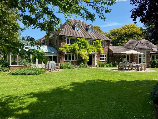 A wonderfully located family home, set in the middle of its land with attractive gardens a