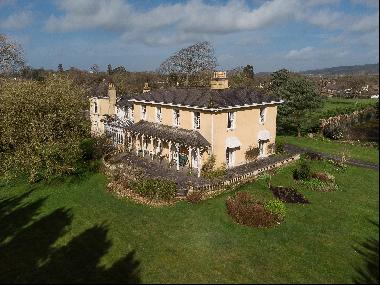 A stunning Grade II listed country house with three separate apartments, stables, arena an