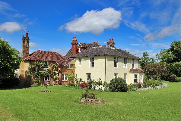 A beautiful Regency Vicarage with attractive features and excellent proportions, surrounde