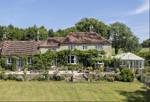 An attractive Grade II listed Georgian country home, set in beautiful gardens, with over 6