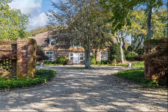 Experience the charm of a unique 19th-century barn-style home nestled within the heart of 