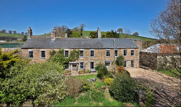 A wonderful home with an annexe in a beautiful setting with over 1.7 acres of land and out