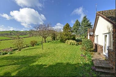 A characterful, south-facing bungalow in a gorgeous rural position with sweeping views acr