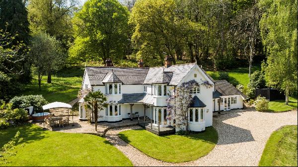 An immaculately presented Victorian country house set in about five acres of enchanting, p