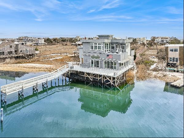 Here is your chance to spend August on Dune Road in Westhampton Beach! This bayfront home 