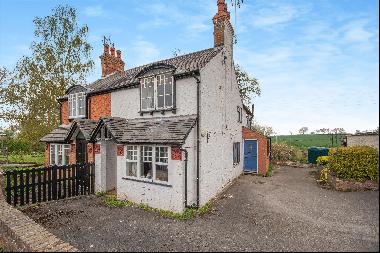 A charming, semi-detached cottage with panoramic countryside views with excellent developm