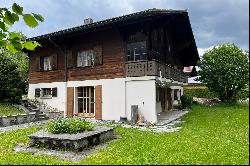 Chalet with two apartments for renovation and building land