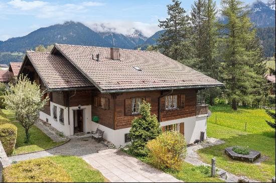 Chalet with two apartments for renovation and building land