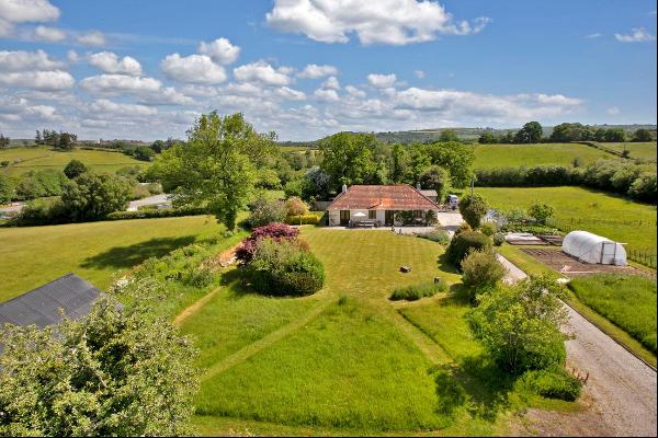 A beautiful home set within an idyllic setting with 1.87 acres of grounds on the edge of t