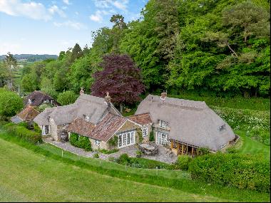 An enchanting, thatched cottage in a private setting with views across lush, unspoilt coun