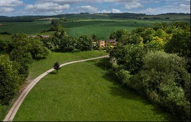 An incredibly private and versatile four bedroom village house and stables with an exquisi
