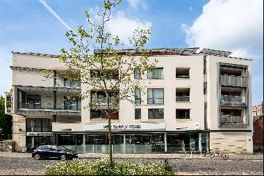 A stunning two-bedroom, third floor apartment with sunny balcony and communal terrace, on 