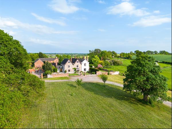 A superb Jacobean manor house with beautiful country views and 3.6 acres, including a lake