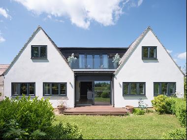 Striking contemporary home with country views on the edge of a highly sought after village