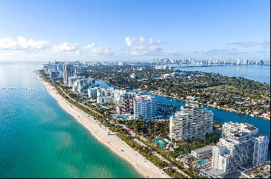 Rising from the most peaceful and expansive stretch of sand on Miami Beachs coastline, The