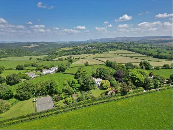 A wonderful family home with over three acres of land and fabulous views over Dartmoor and
