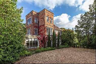 An incredibly striking principal portion of a fine country house in an enviable setting on