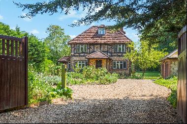 A delightful 1901 Arts and Crafts style house that is well set back within a large and pri