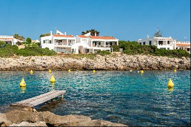 Typical sea house on the seafront with tourist licence in Biniancolla, Menorca