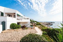 Typical sea house on the seafront with tourist licence in Sant Lluís, Menorca