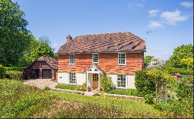 A light and well-presented family home with a paddock and delightful garden.