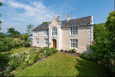A beautiful historic house with a fantastic, versatile range of outbuildings with ten acre