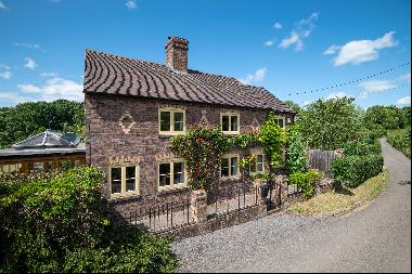 A beautifully appointed country cottage with outbuildings, ancillary accommodation standin