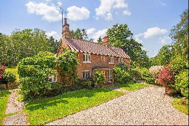 Period farmhouse with about 2 acres of gardens and grounds.