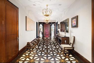 As you step into the private elevator landing of this 6,637-square-foot condo beauty, you 