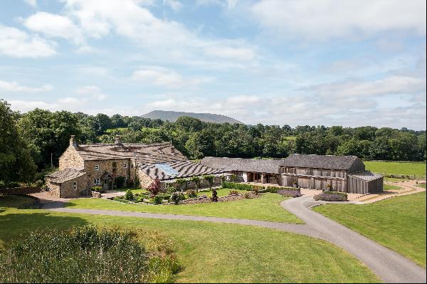 An outstanding barn conversion with separate cottage surrounded by its own land with drama