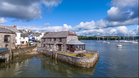 A charming fully furnished detached cottage, with direct water access via steps and a slip