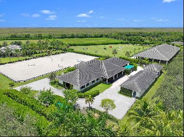 This incredible estate is perfectly situated on over 9.4 acres in The Saddle Club. Uniquel