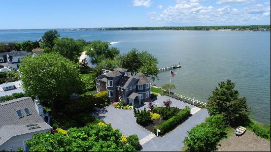 Waterfront living in Hampton Bays! This exceptional property boasts an idyllic location ri