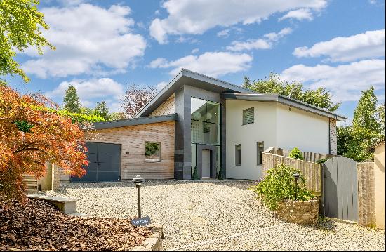 An architecturally designed detached house with superb views that has been finished to exc