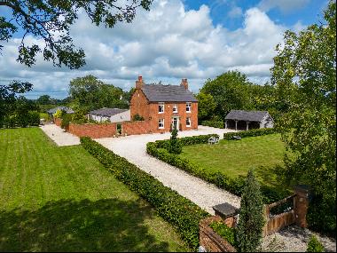 A period family home with ancillary accommodation and land totalling 1.47 acres on the edg
