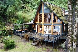 House on the first line in front of Lake Todos Los Santos