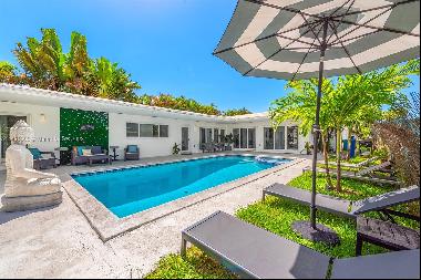 Indulge in waterfront extravagance with this 3-bed, 2.5-bath, furnished Miami River retrea