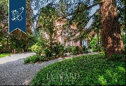 Luxury estate with a big private garden for sale in one of Lombardy's most exclusive green