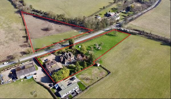 A spacious family home offering flexible accommodation with paddocks and an orchard.