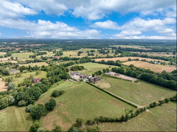 A well-positioned farm with extensive outbuildings set in about 40 acres on the edge of th