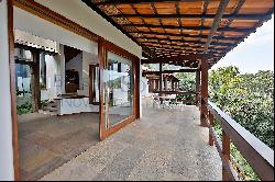 House in a gated community surrounded by a wooded area in Sao Conrado