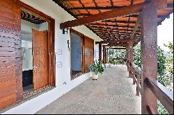 House in a gated community surrounded by a wooded area in Sao Conrado