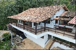 House in a gated community surrounded by a wooded area in Sao Conrado