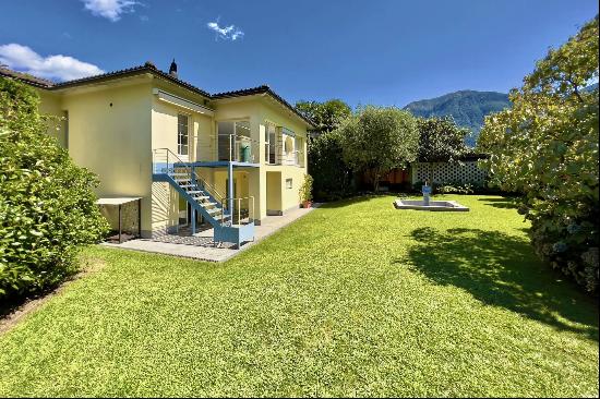 Modern style villa surrounded by greenery in Ascona for sale