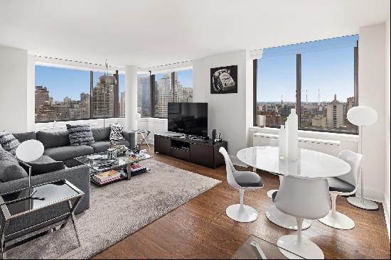 Stunning City Views from every room in this turnkey two-bedroom, two-bathroom corner resid