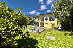 Modern style villa surrounded by greenery in Ascona for sale