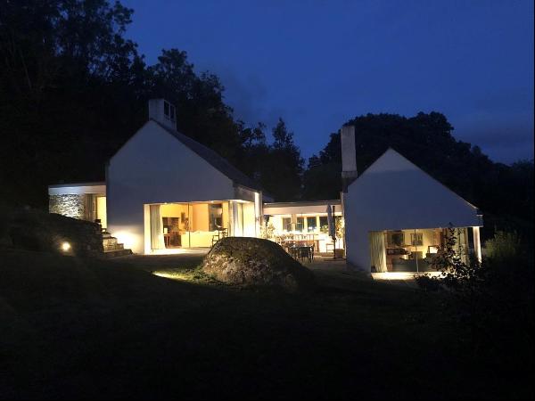 An outstanding modern Eco-home, built to the highest of specifications with land and woodl