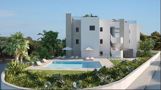 New built three bedroom luxury apartment with a large garden near the beach of Cala Llenya