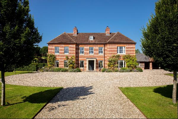 An immaculately presented country house, set in an elevated position with far-reaching sou